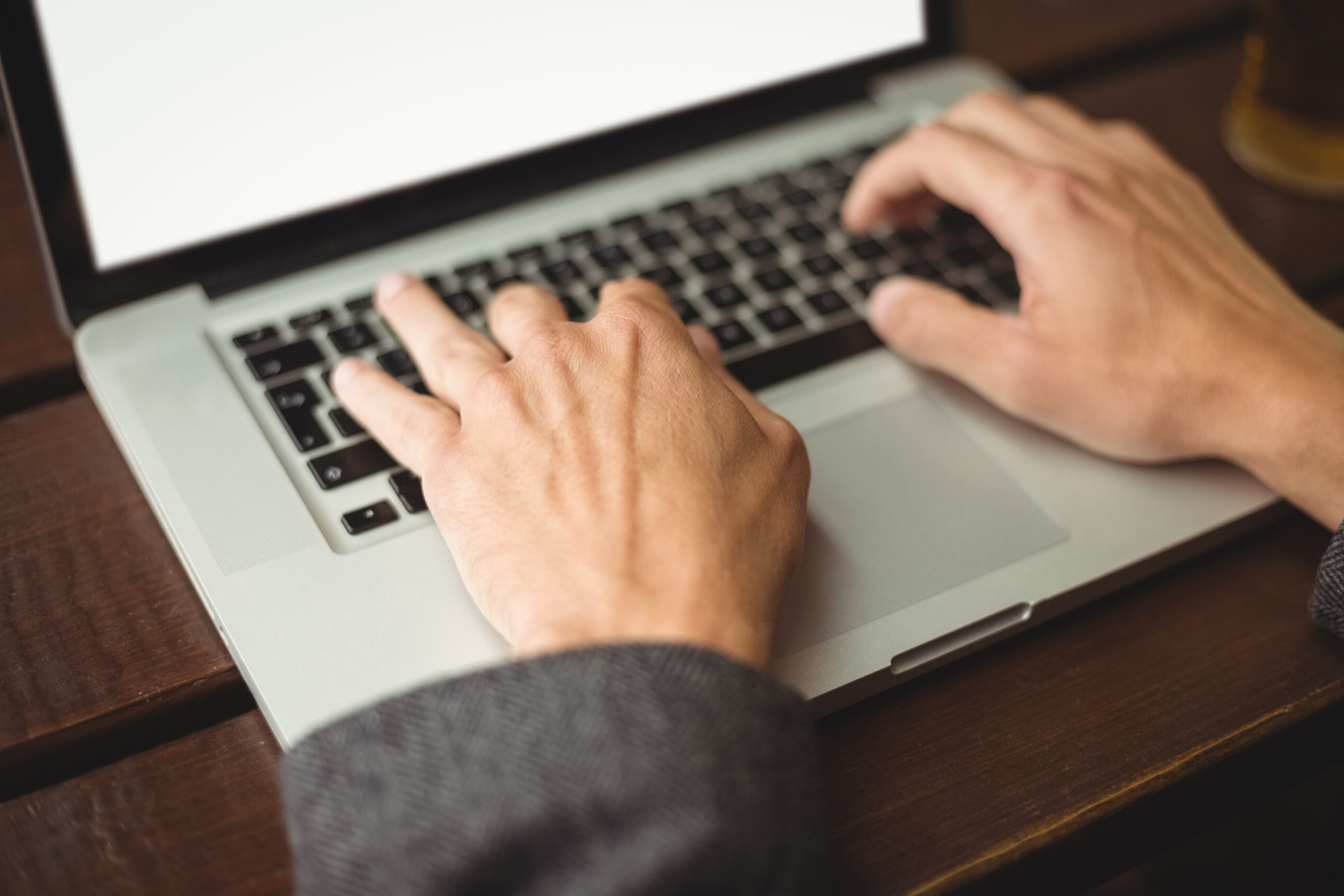 man using laptop scaled e1748424250666.jpg